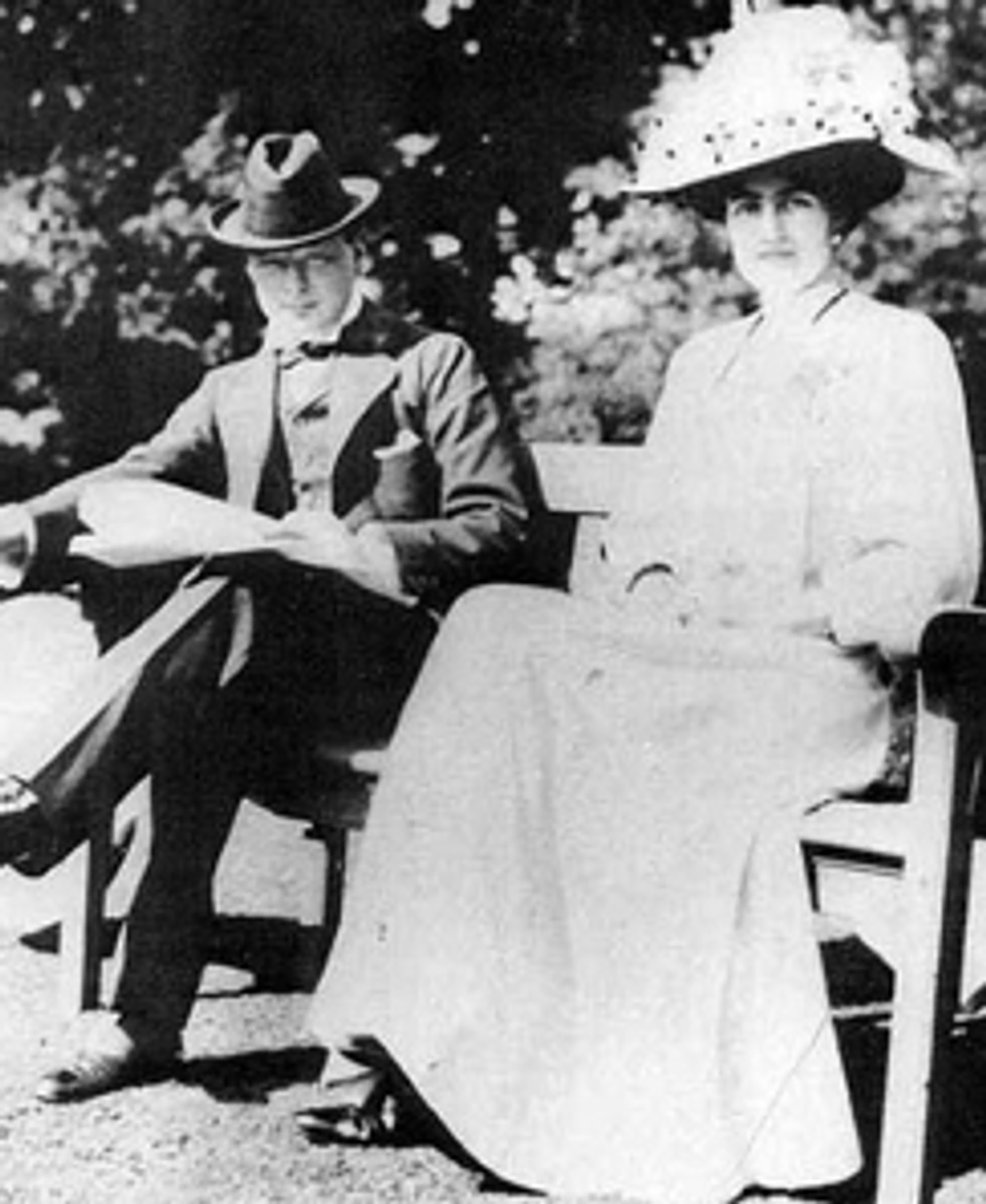 Churchill seated outside next his wife Clementine