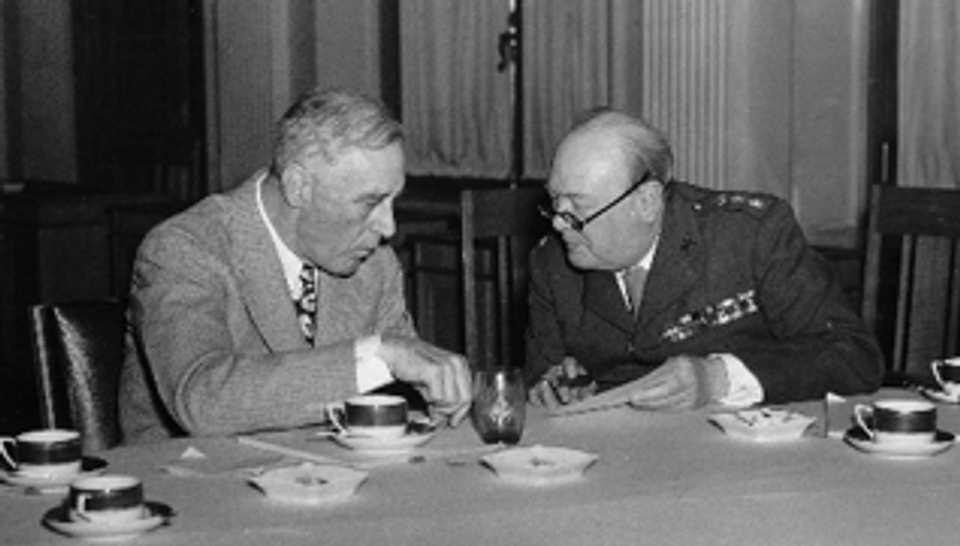 A photograph of Winston Churchill sitting with Franklin D. Roosevelt at the Yalta Conference