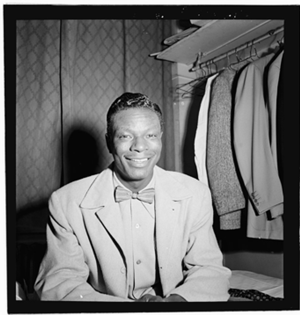 A photograph of Nat King Cole in 1946 at the Paramount Theater in New York City.