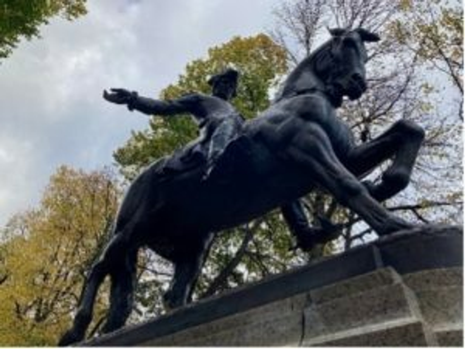 A statue depicting Paul Revere riding a horse