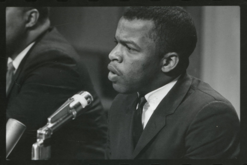 A black and white photo of John Lewis speaking at a meeting of American Society of Newspapers, 1964.